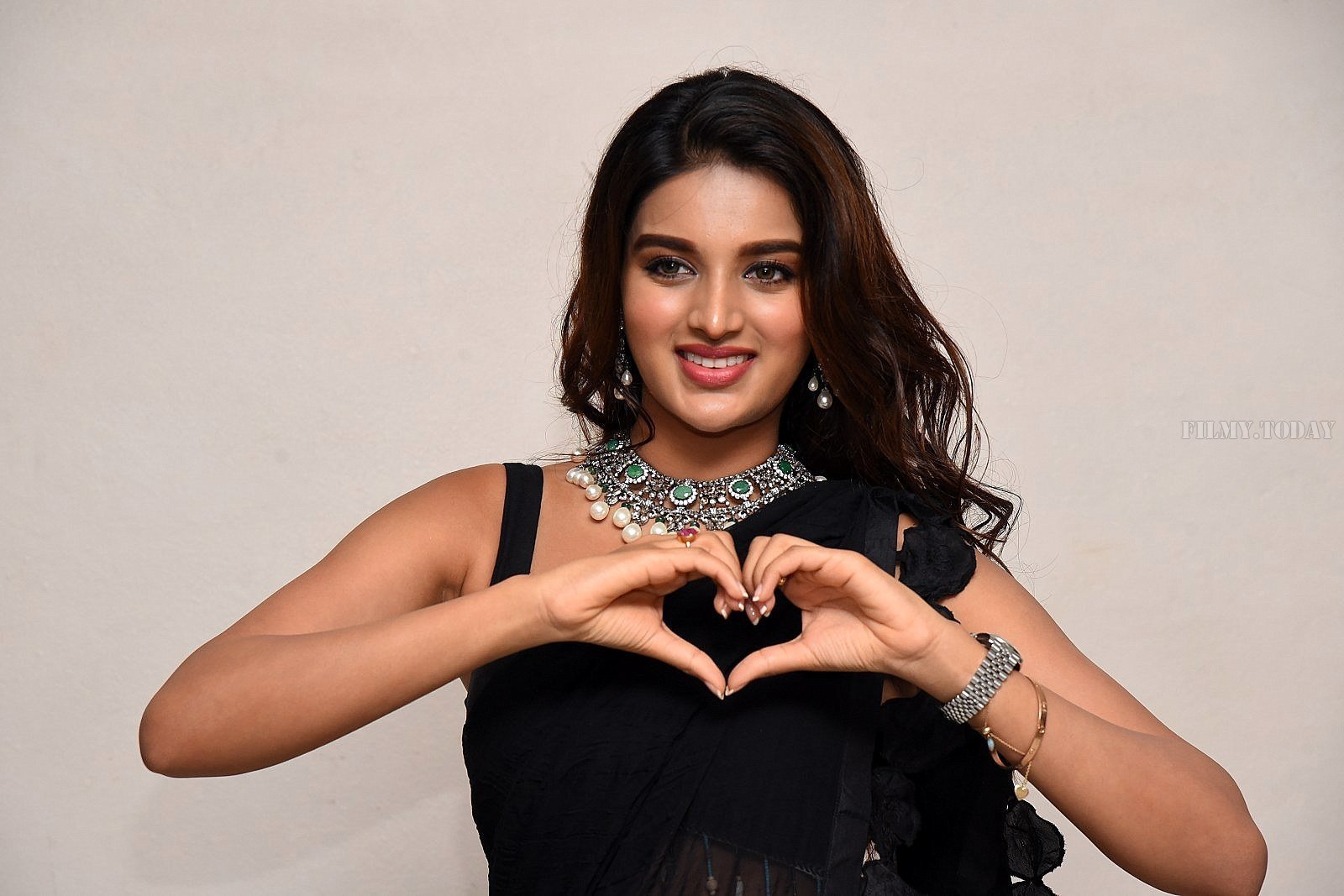 In Pics: Nidhhi Agerwal In Black Saree At Ismart Shankar Pre Release Event | Picture 1662730